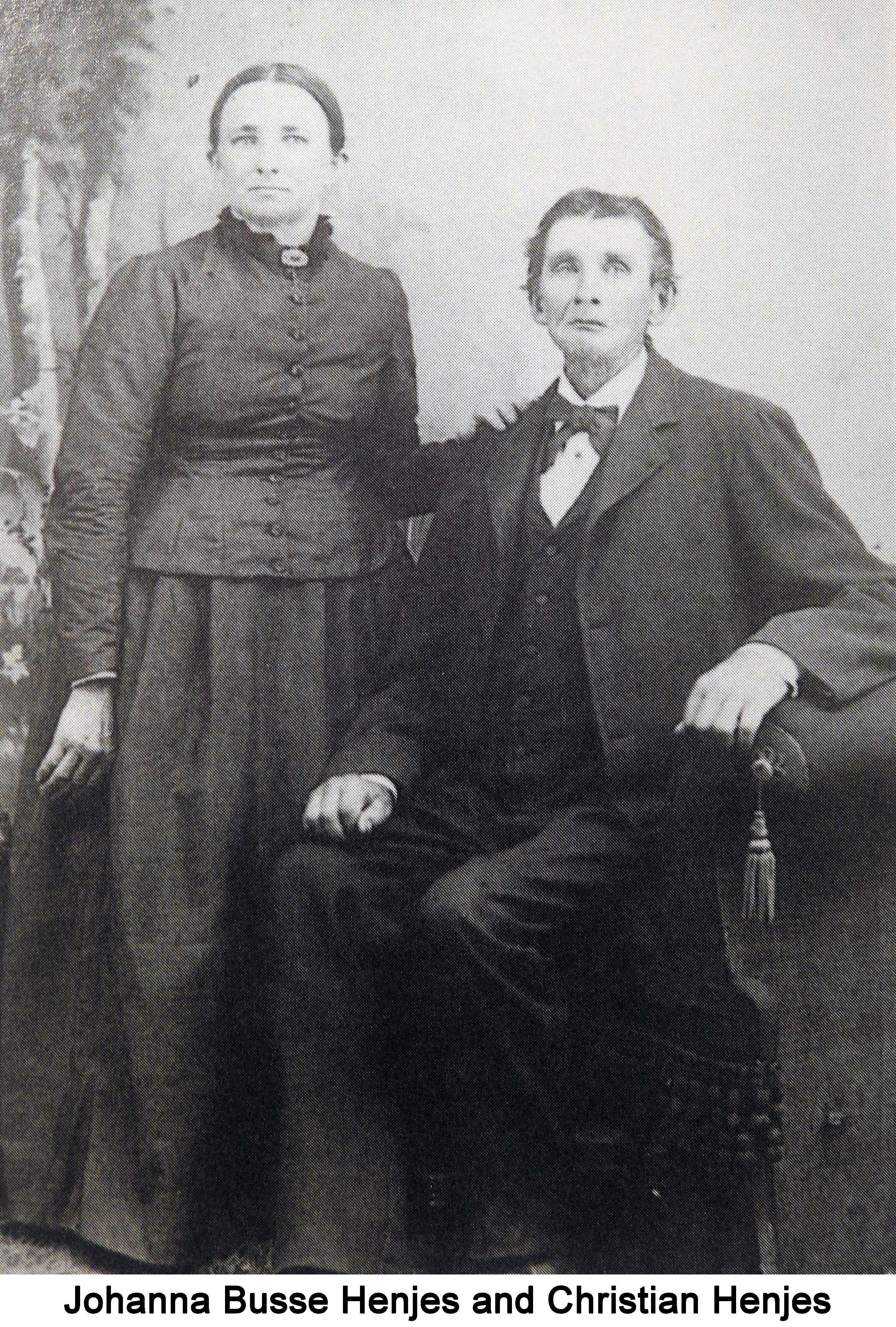 Johanna Busse Henjes standing with her hand on the shoulder of Christian Henjes 
           who is seated