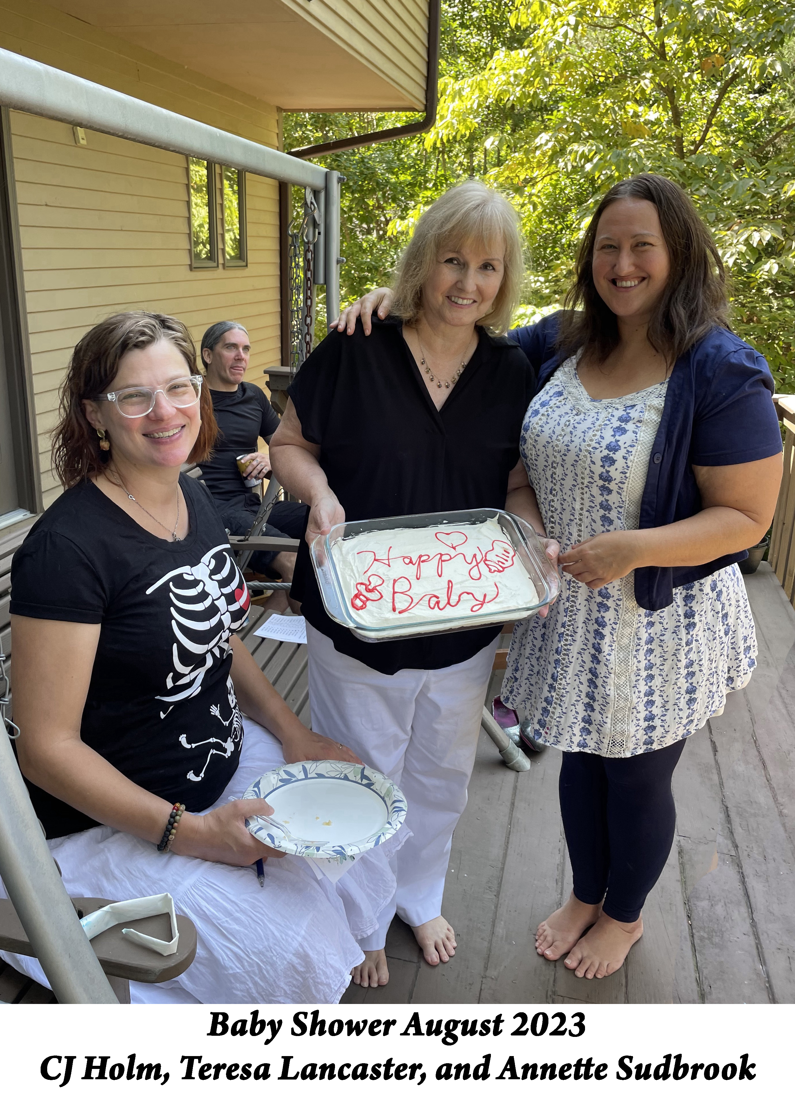 CJ, Teresa, and Annette are posing with the cake that Teresa made