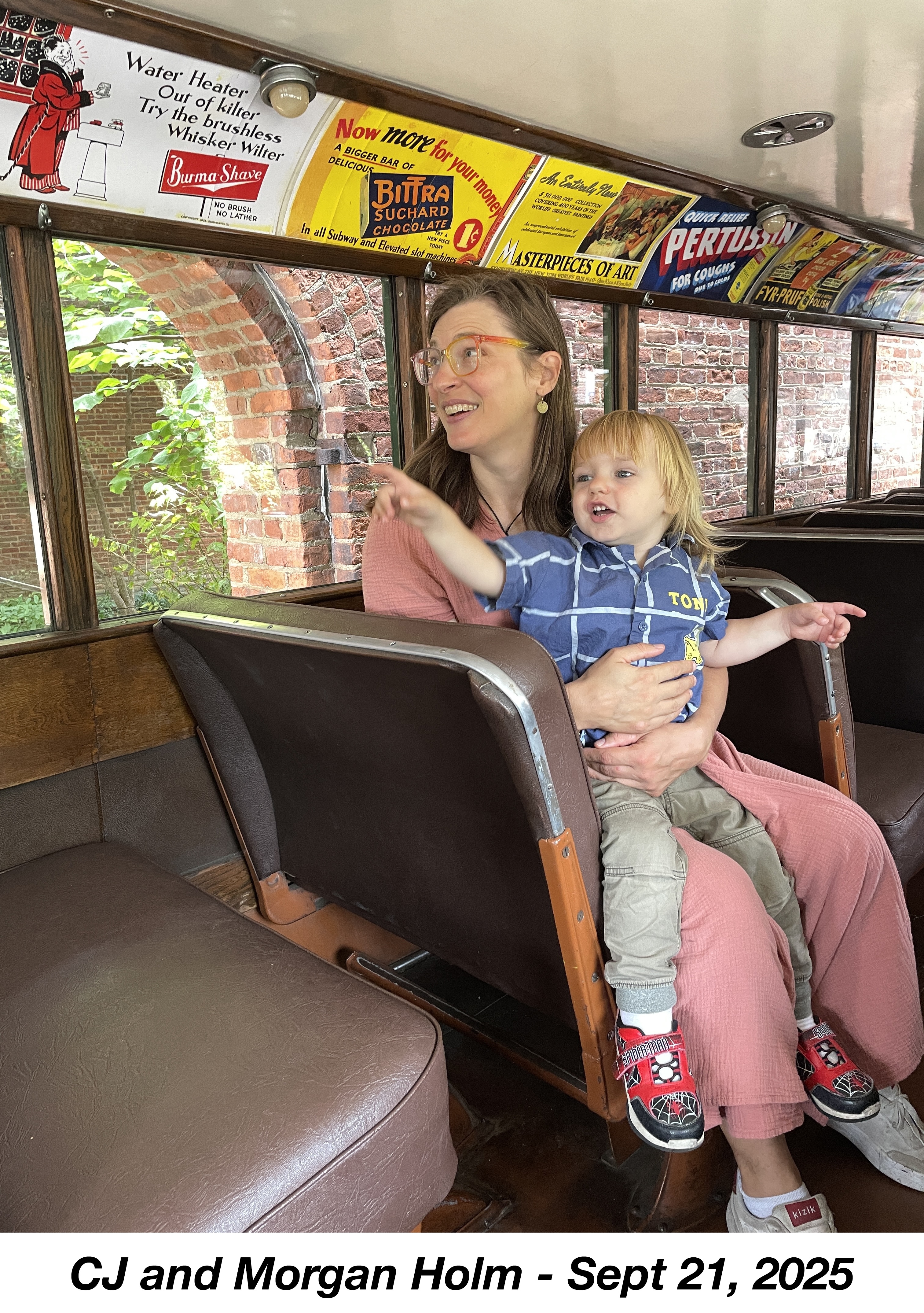 They are looking to the left and smiling.