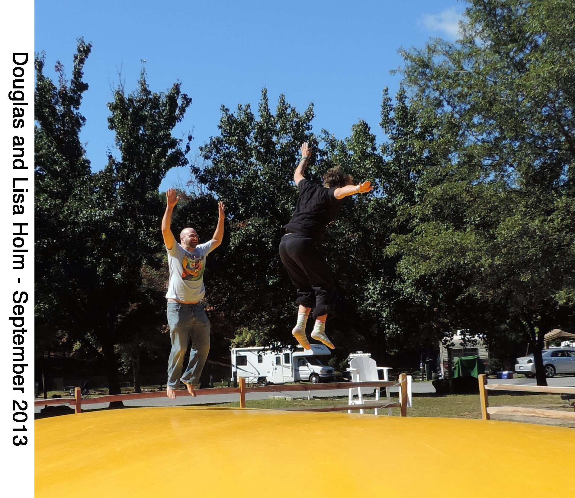 Doug and Lisa bouncing above the campgrounds giant jumping pillow