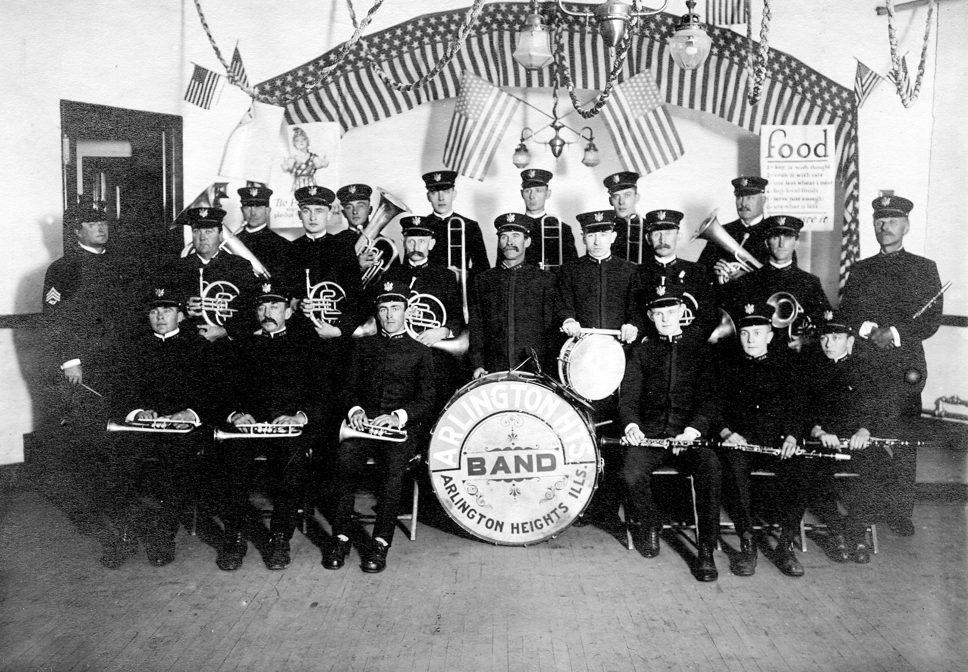 Members of the band are in three rows; Fred Henjes sits in the front row