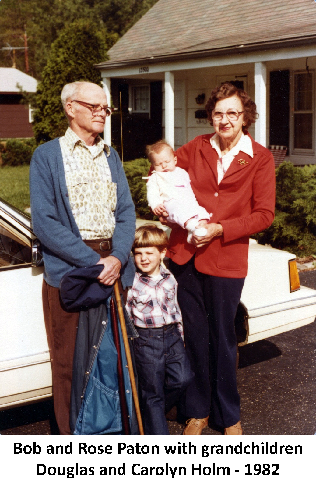 Bob and Rose Paton standing with grandson Douglas Holm and
           holding Carolyn Holm in 1982