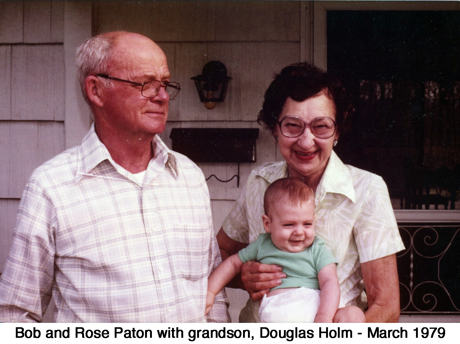 Bob and Rose Paton; Rose holds smiling grandson, Douglas Holm