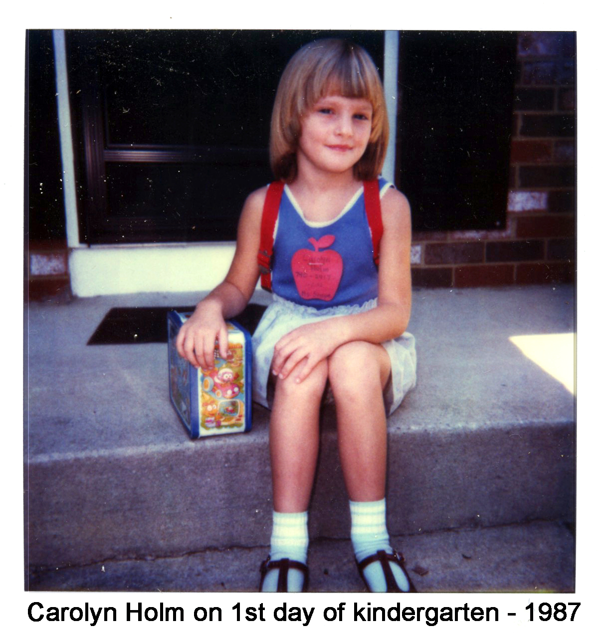 Carolyn Holm sitting on our front porch before leaving for kindergarten