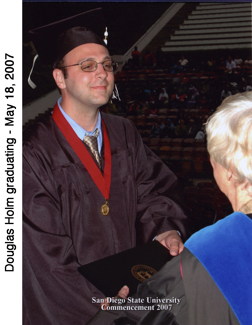 Doug Holm receiving graduaton certificate at SDSU