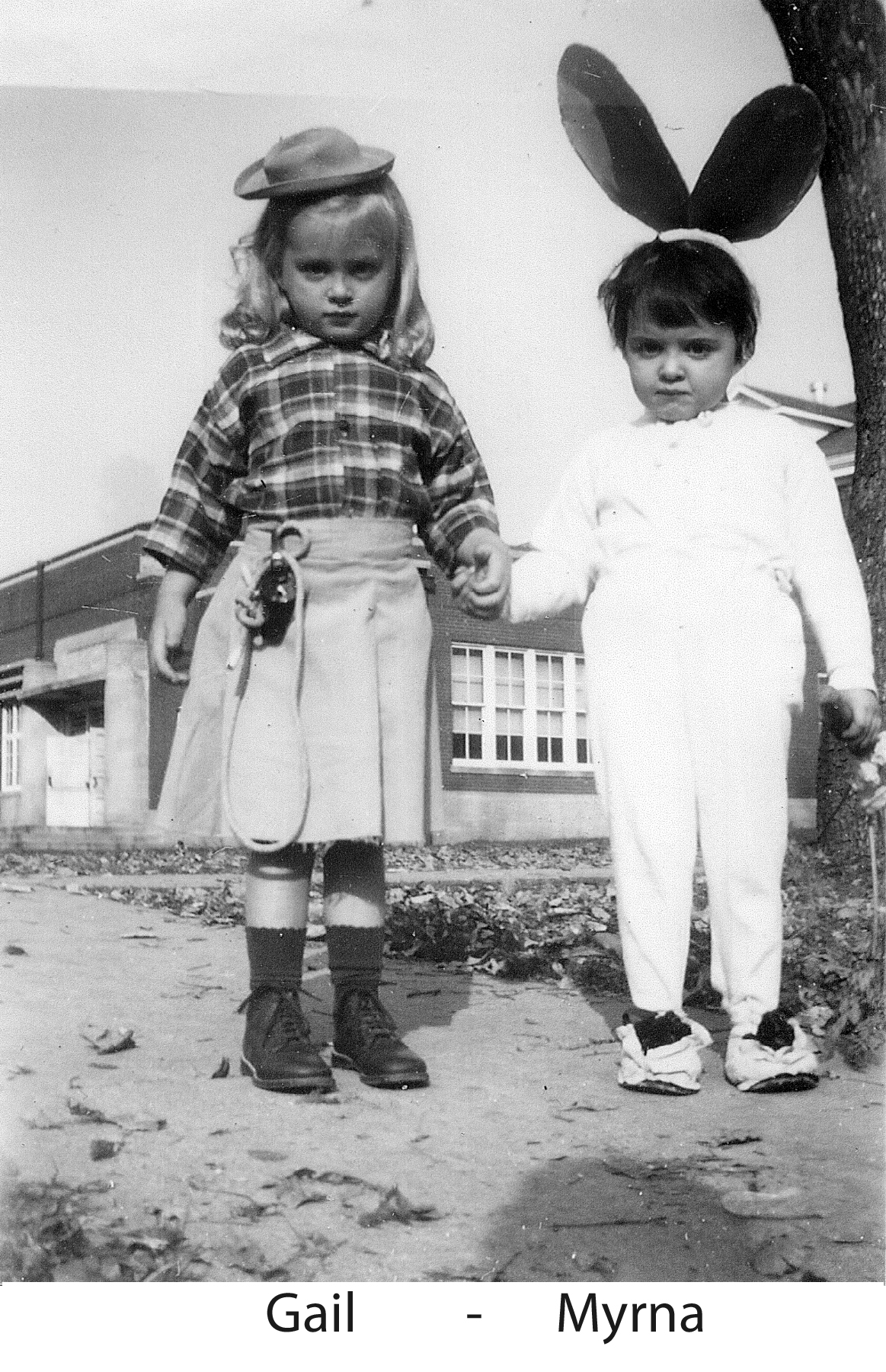 Gail Paton and her friend Myrna Moericke standing and holding hands