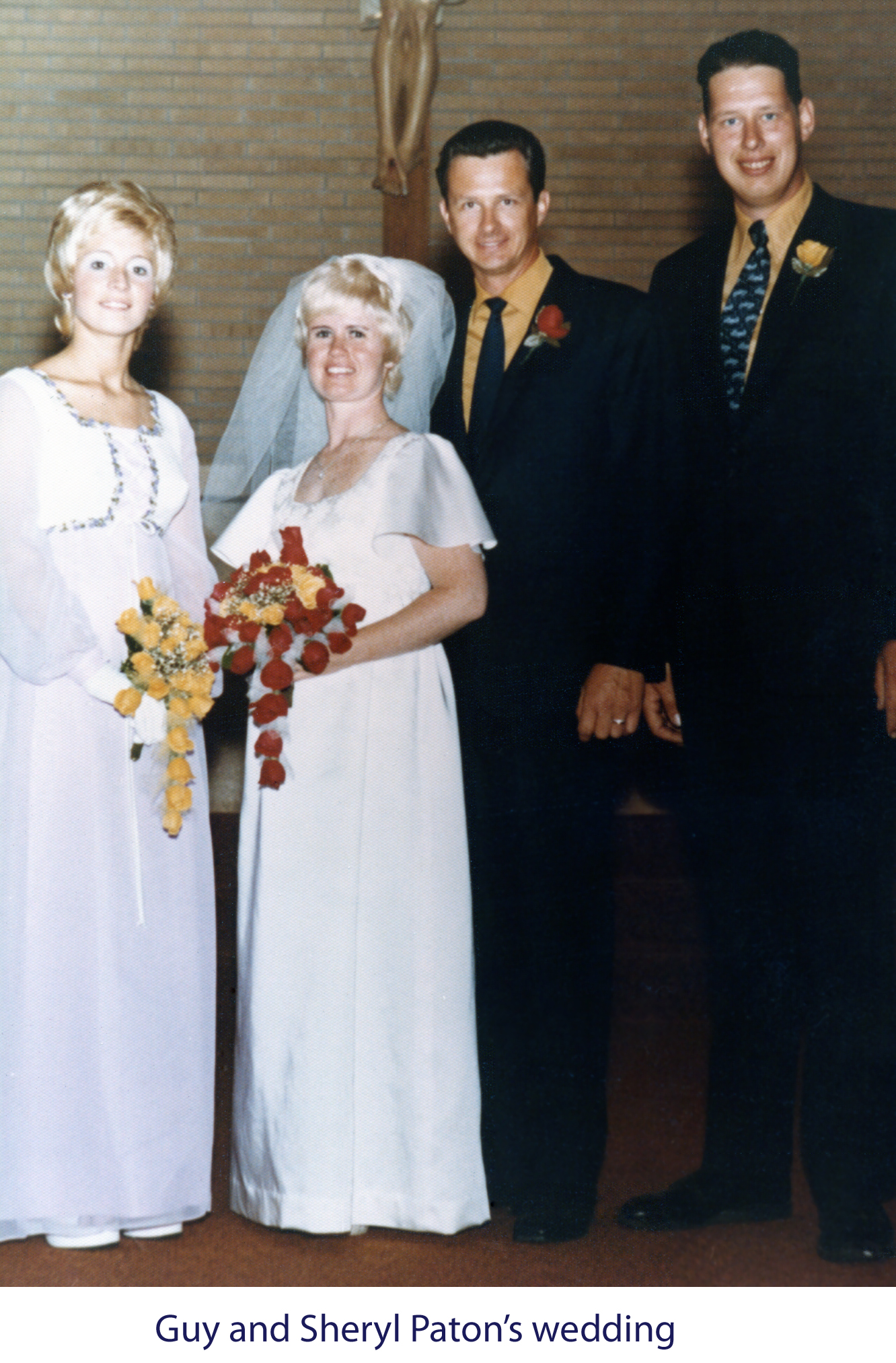 Sheryl and Guy Paton in a wedding photo with their attendents