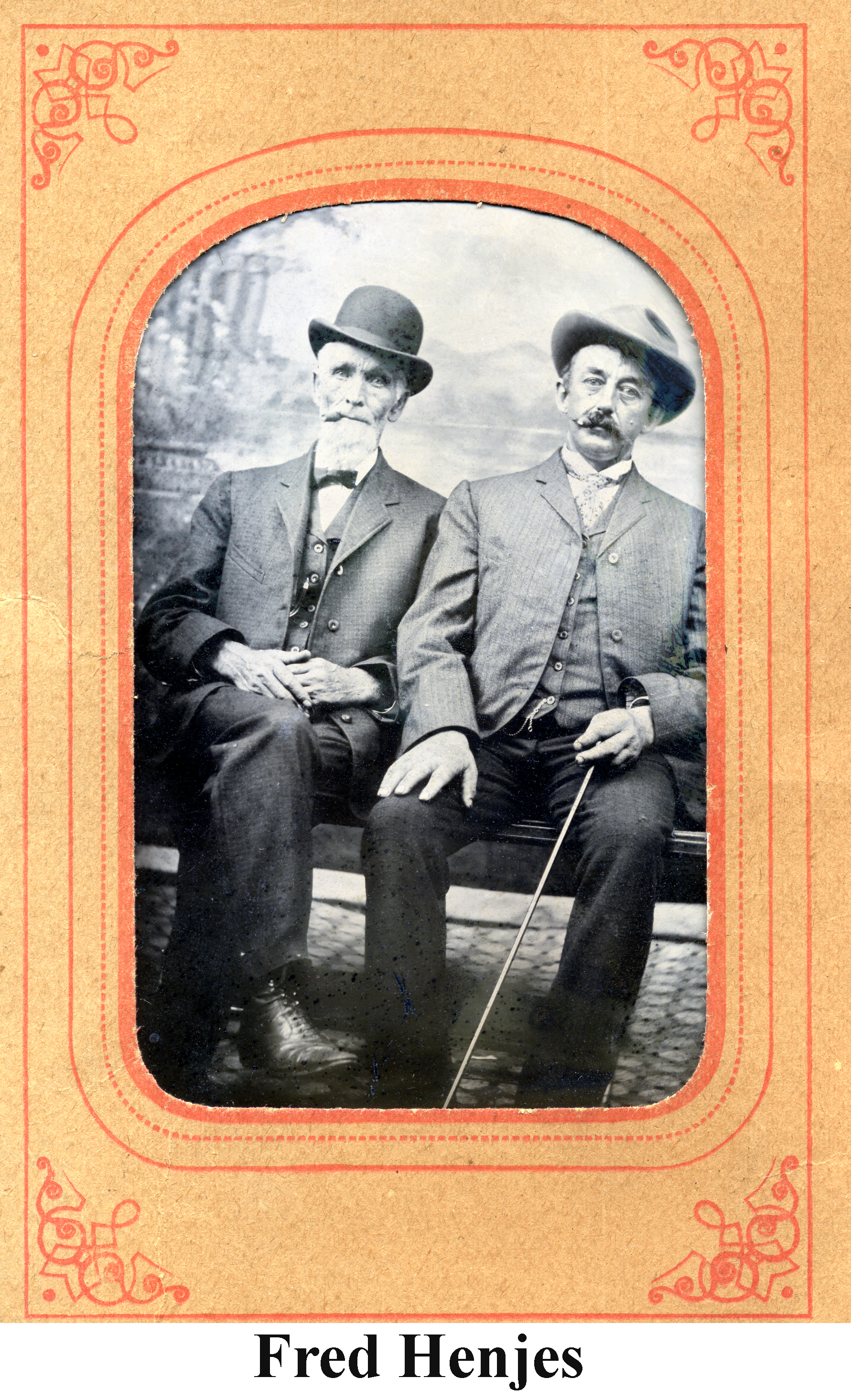 Fred Henjes and an older, white-bearded man in a tintype. The picture hasa nice orange cardboard frame.
