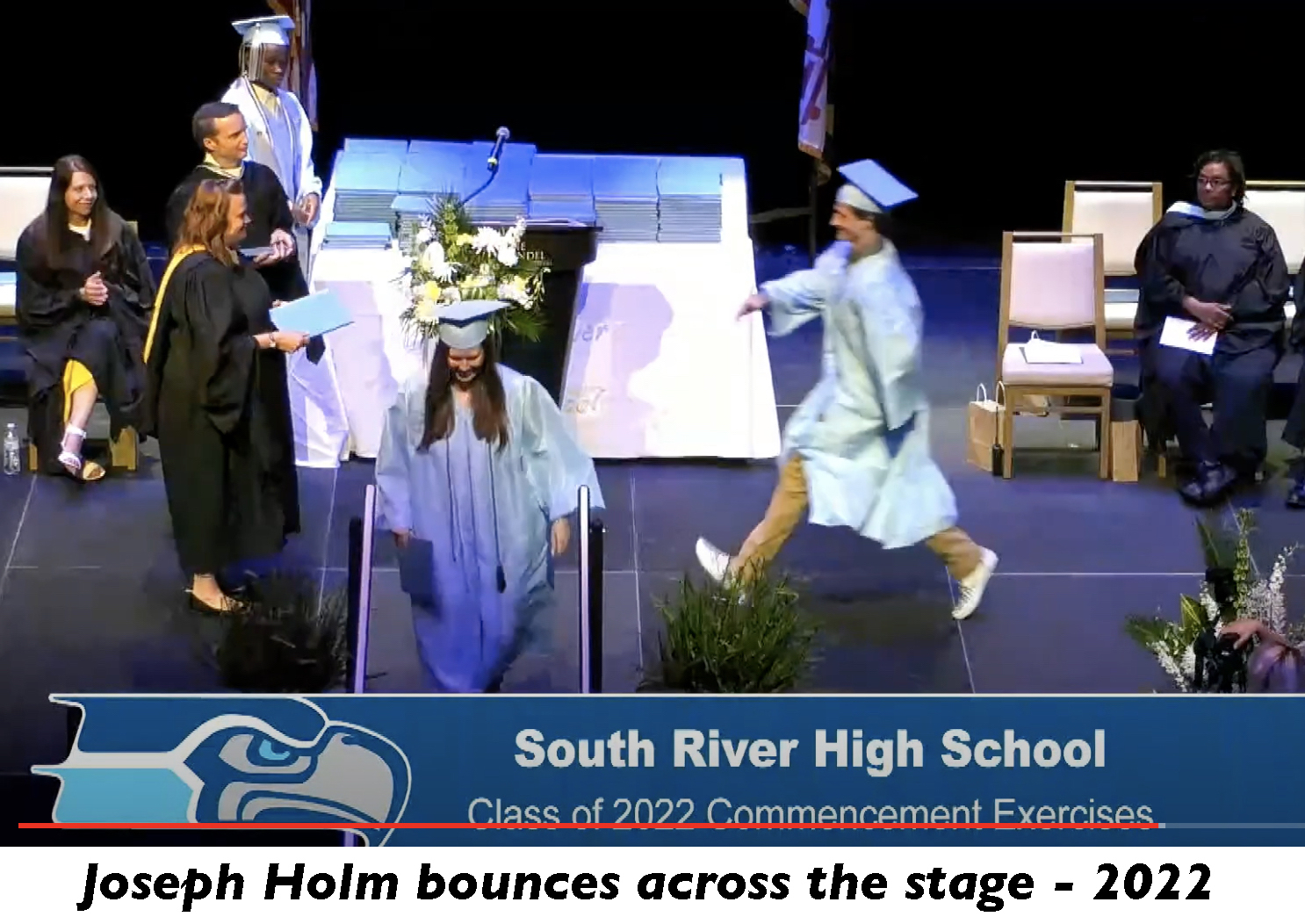 Joseph Holm bounces across the stage at his graduation