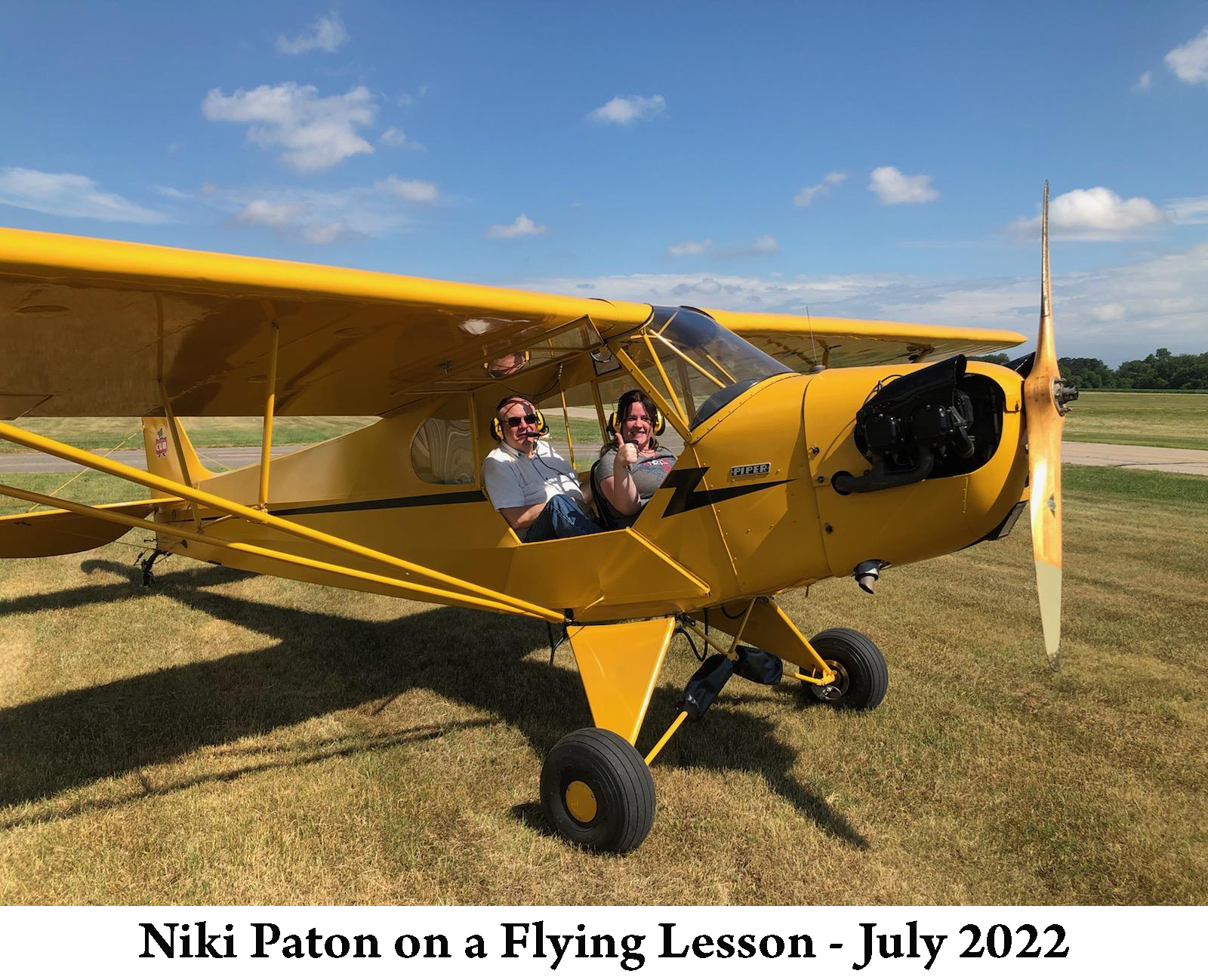 Niki Paton with her flight instructor in a Piper J-3 Cub