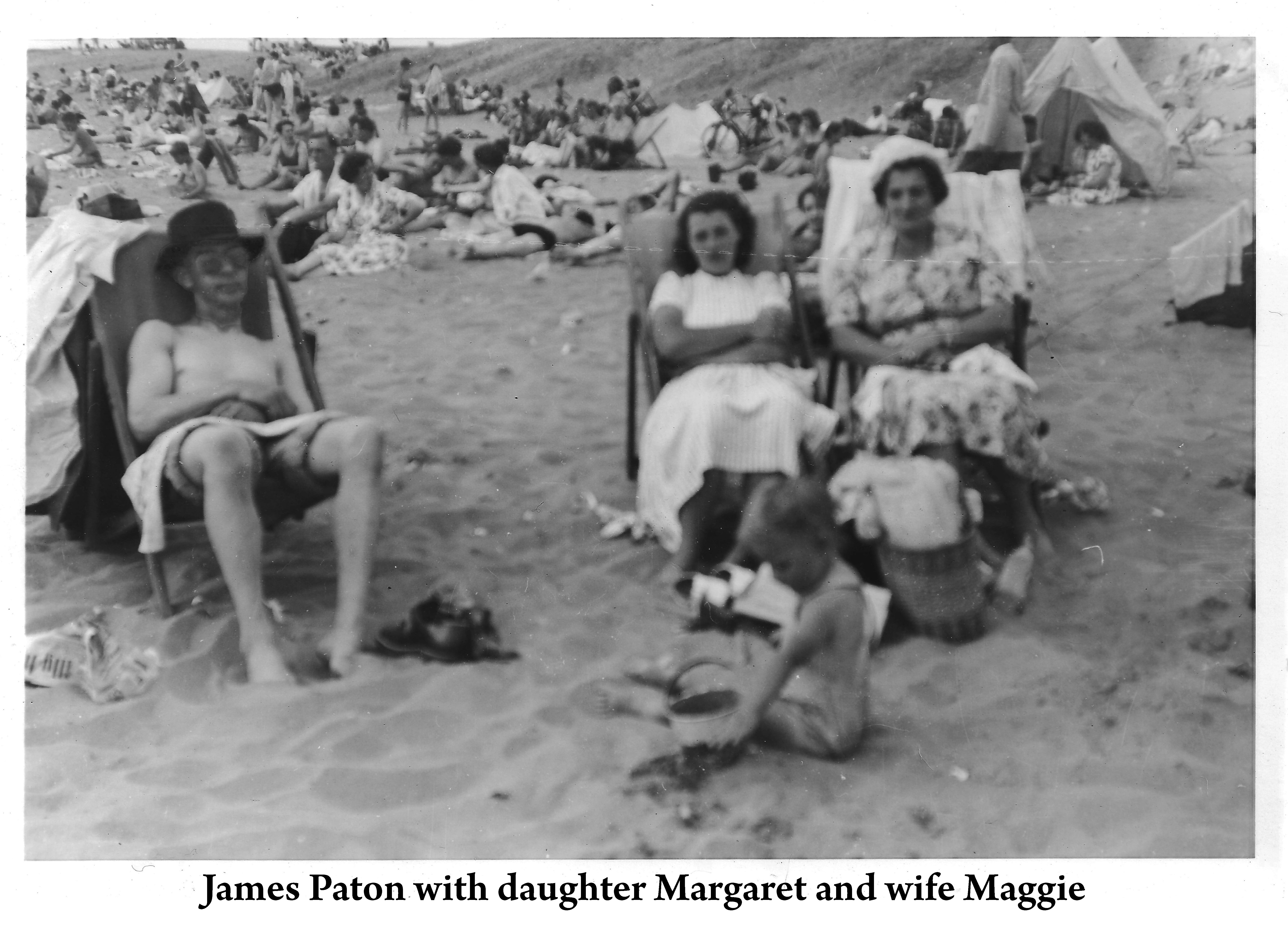 James, Margaret, and Maggie are sitting in beach chairs 