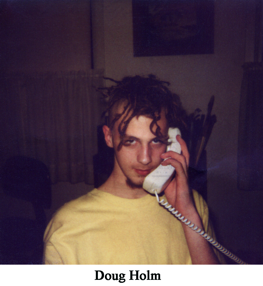 Polaroid snapshot of Doug with dreads and on the phone
