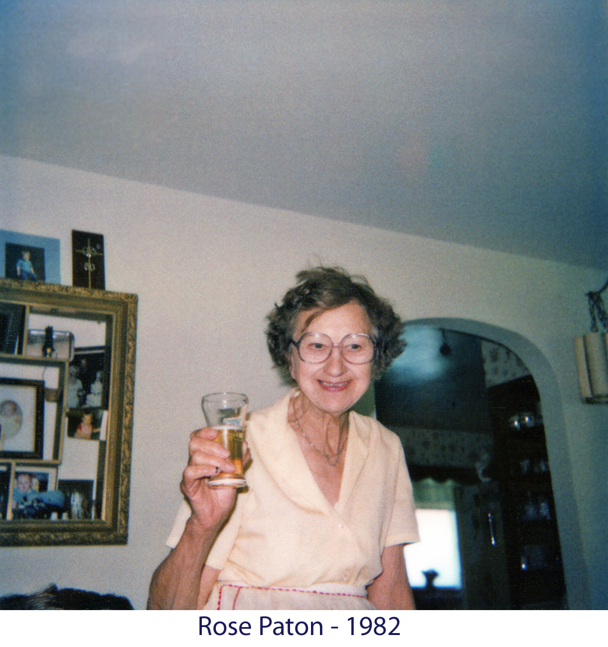 Rose Paton with a glass of beer at home in June 1982