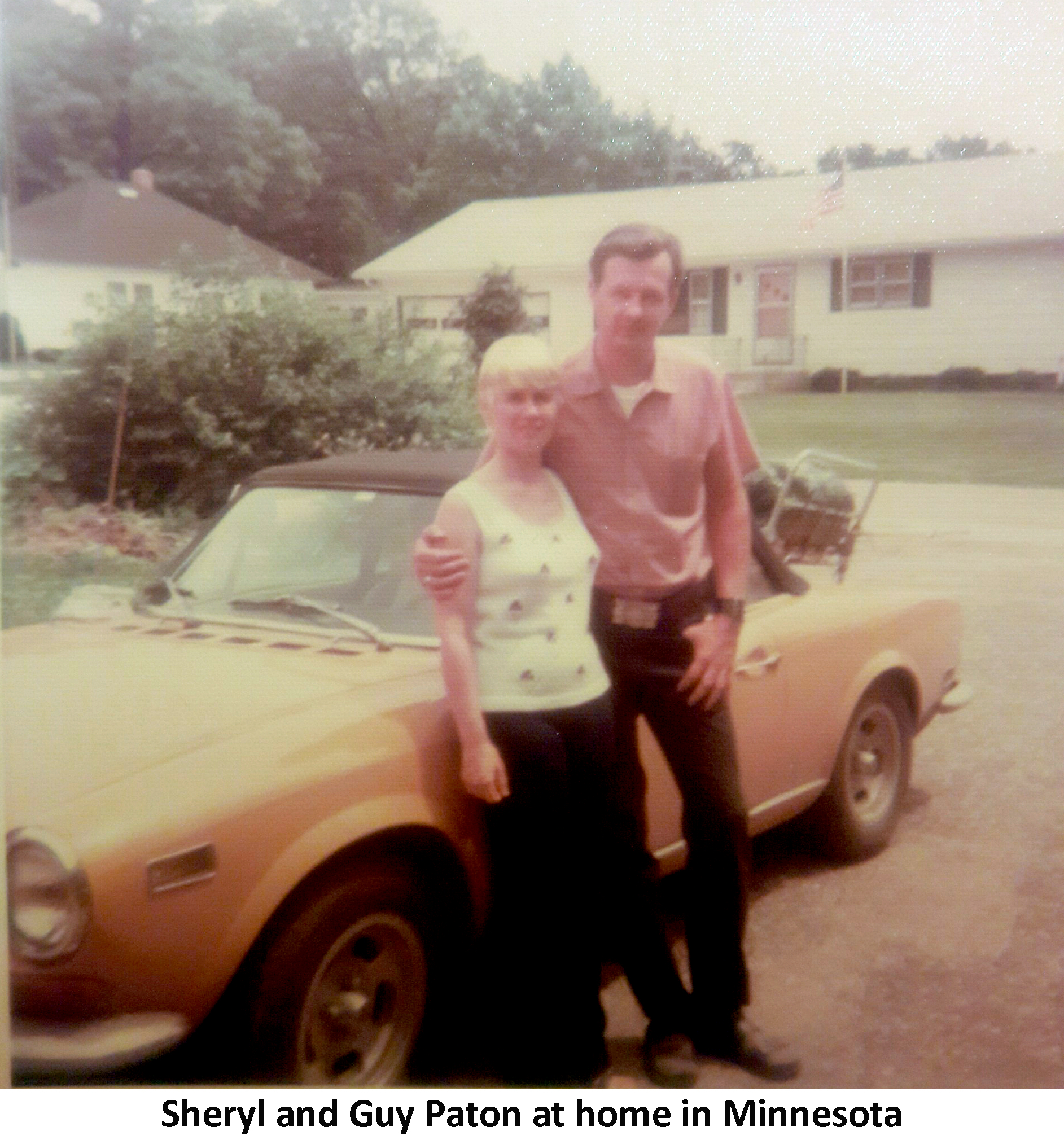 Sheryl Beskar and Guy Paton are leaning against his yellow
             Fiat convertible in a suburb of Minneapolis