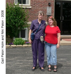 Gail Holm and Niki Paton standing together in front of the church