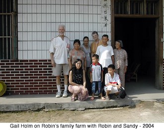 Gail with others in front of the Chinese farmhouse 