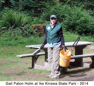 Gail Holm with cleaning tools at a picnic table