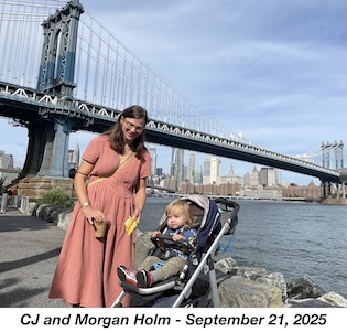 Morgan is in his stroller by the East River with the Manhattan Bridge in the               background. CJ is holding his cup and a banana peel.