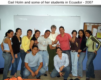 Gail Paton Holm posing in a room with her Ecuadorian students 