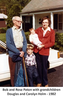 Bob and RosePaton standing with grandson Douglas Holm and
           holding Carolyn Holm in 1982