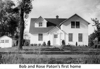 The first home of Bob and Rose Paton, a two story building with white siding
