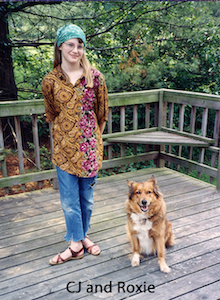CJ Holm standing on our deck with Roxie sitting by her side