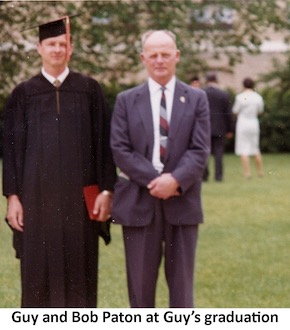 Guy Paton in his graduation robes standing next to his father