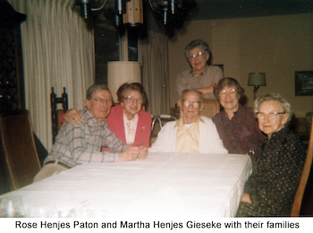 Rose Henjes Paton, Martha Henjes Gieseke and families sitting around a table
