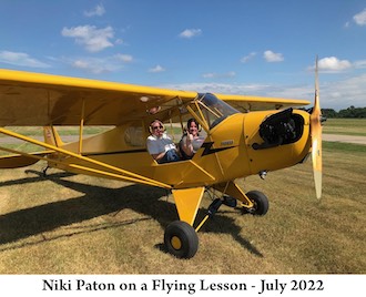 Niki Paton with her flight instructor in a Piper