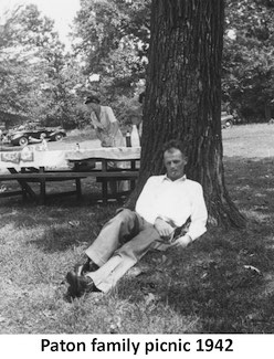 Bob Paton lounging below a tree on a picnic