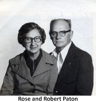 A formal, black-and-white protrait of Rose and Robert Paton.          She is wearing a checkered jacket and he has a dark jacket without a tie.