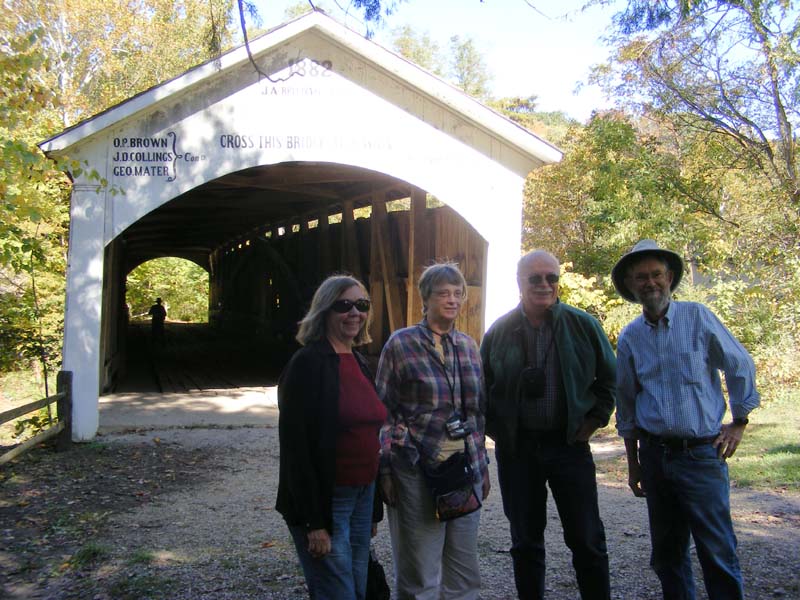 Ann Zink, Gail Holm, Bob Bower, and Bill Burke standing in front of the Narrows Bridge