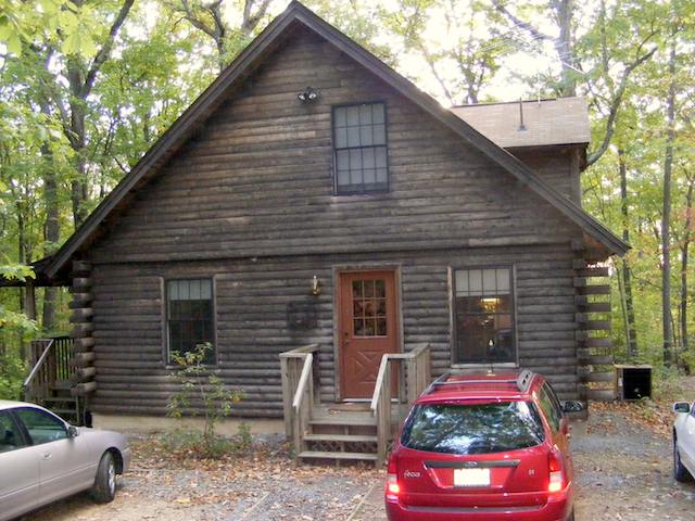 Photo of the cabin from the west while the sun was rising Monday morning