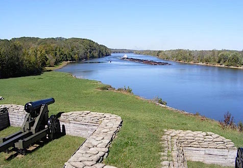 A coal barge comes up the Cumberland River 
             under the muzzles of one of the cannon of the lower battery