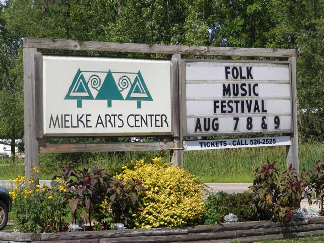 Sign at the Mielke Arts Center announcing the Folk Music Festival, Aug 7-9