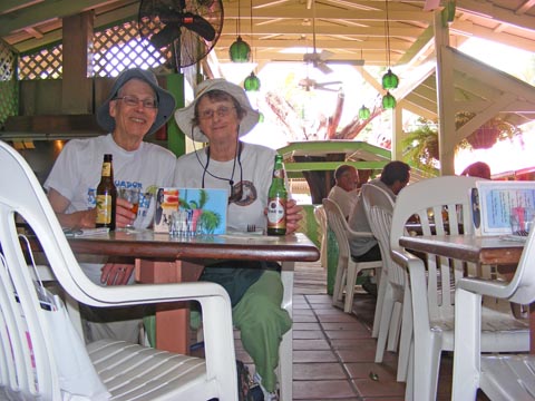 Gail and Al at a 
table in the Lime Inn with a couple bottles of beer