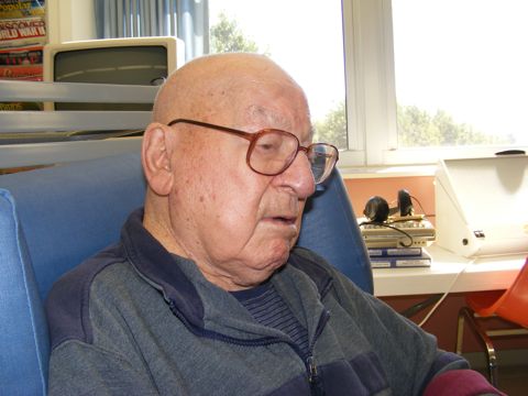 Murray in front of the window in the library 
               of the Jacobetti Home for Veterans